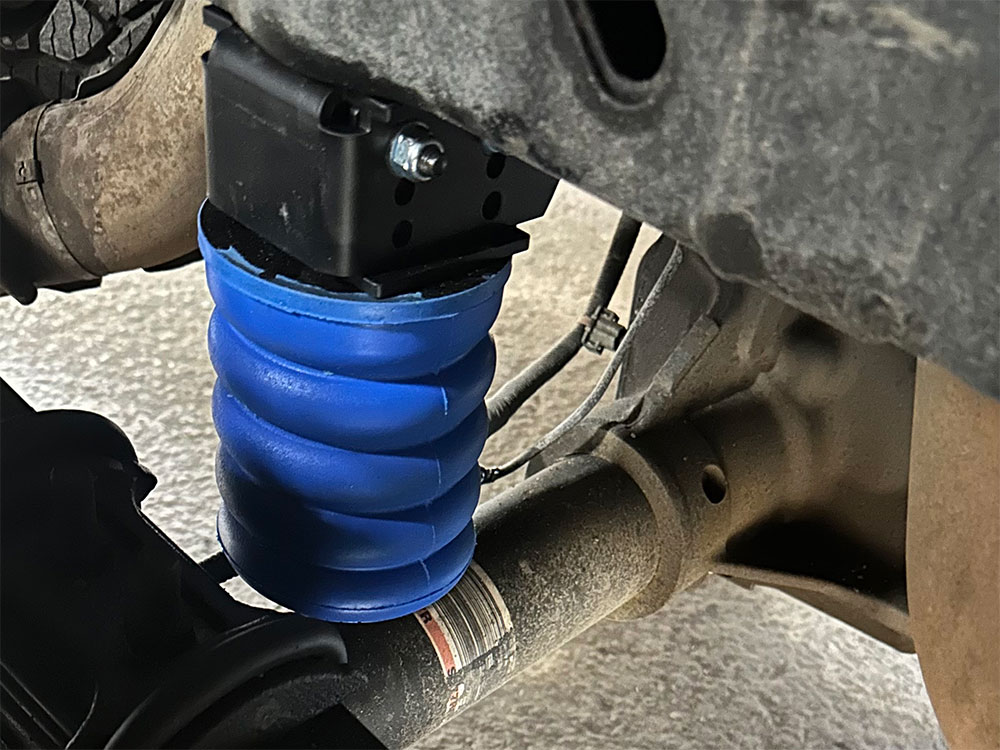 SumoSprings suspension aid on a truck rear axle